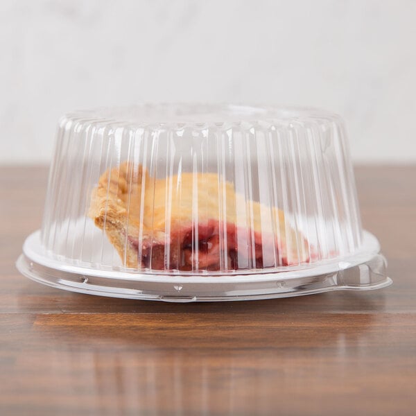 A piece of pie in a Dart clear plastic container.