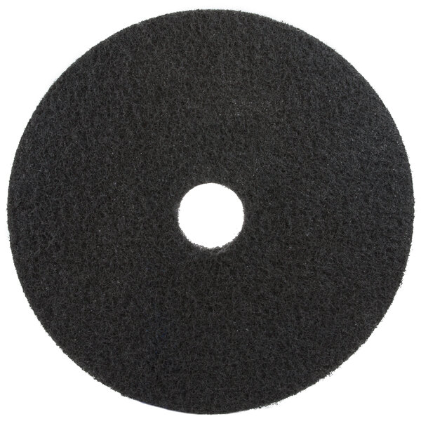 A black 3M 7200 stripping floor pad with a hole in the center.