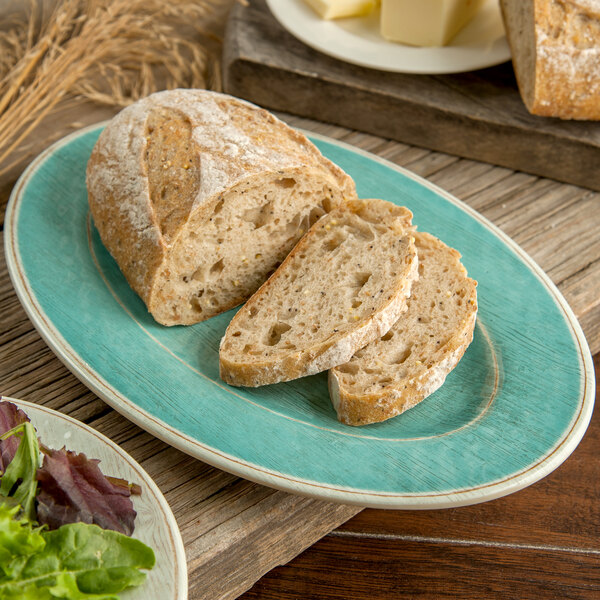A Carlisle Aqua melamine platter with slices of bread on it.