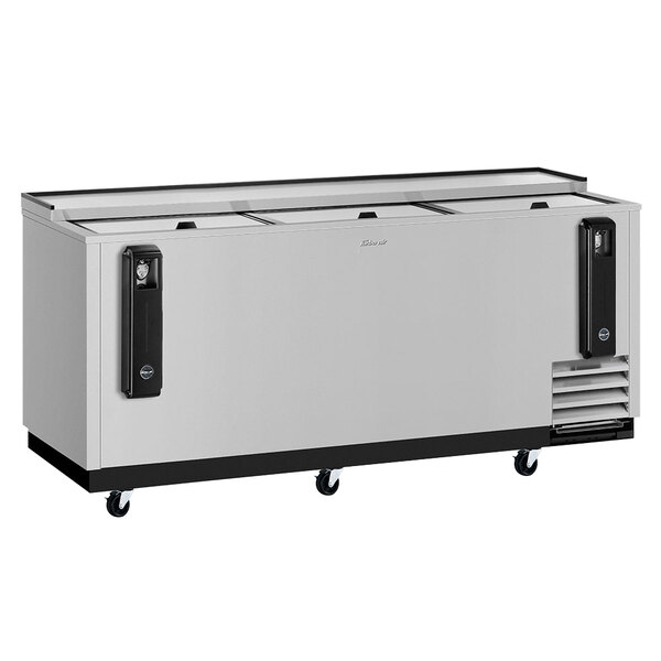 A Turbo Air stainless steel bottle cooler with two doors and two drawers.