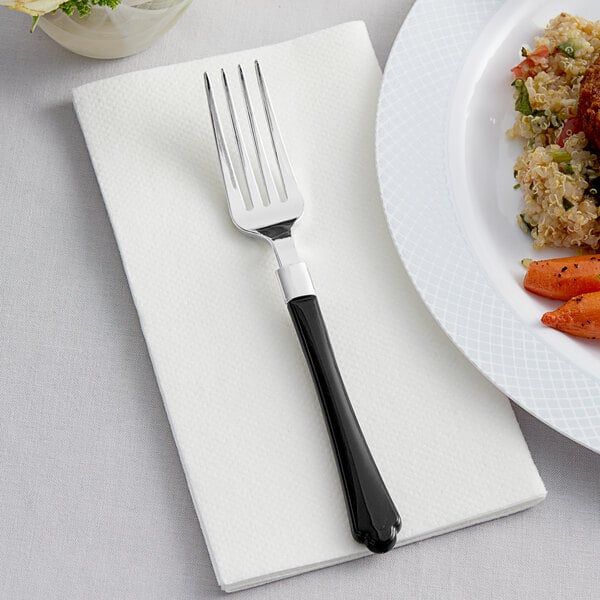 A close-up of a Visions silver plastic fork with a black handle.