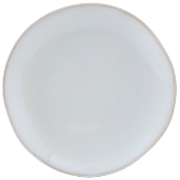 A white Tuxton Artisan china plate with a small rim.