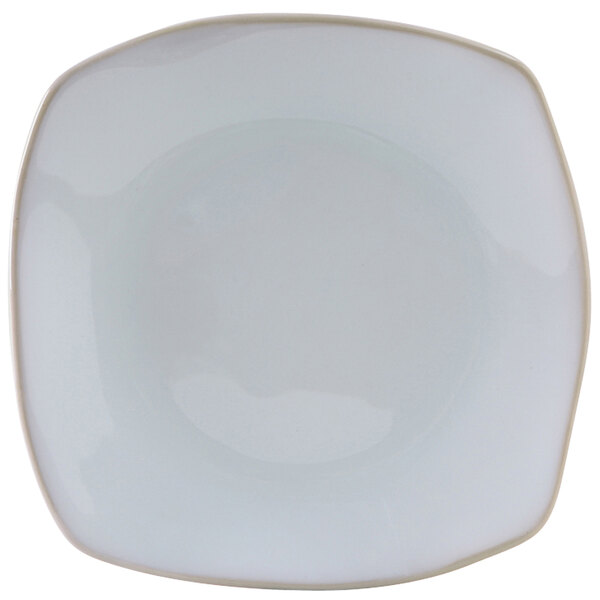 A white Tuxton Artisan china pasta plate with a small circle in the center.