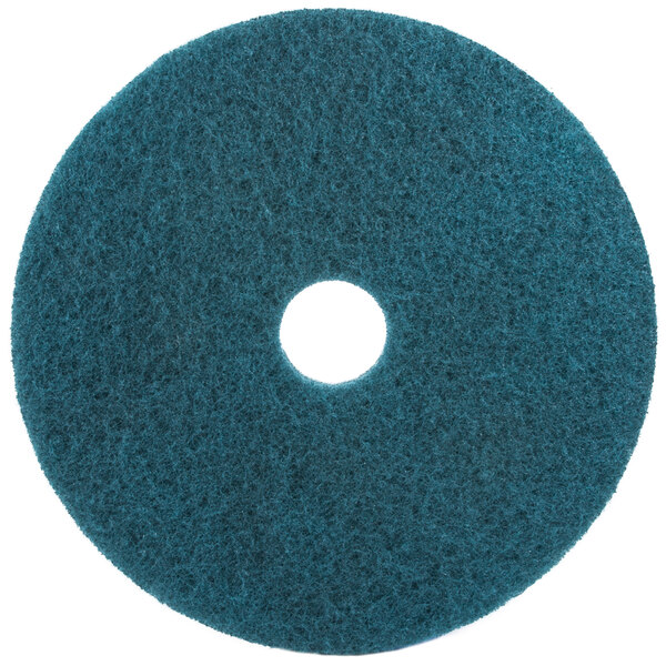 A white circle on a blue 3M 5300 floor pad.