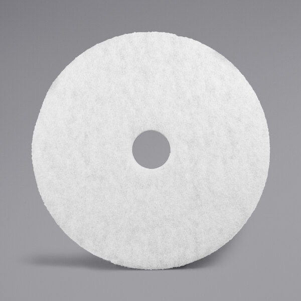 A white circular 3M Super Polishing pad