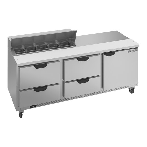 A Beverage-Air refrigerated sandwich prep table with 4 drawers on a stainless steel counter.