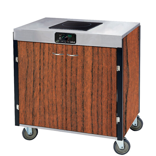 A Victorian cherry wood and stainless steel Lakeside mobile cooking cart with an induction burner.