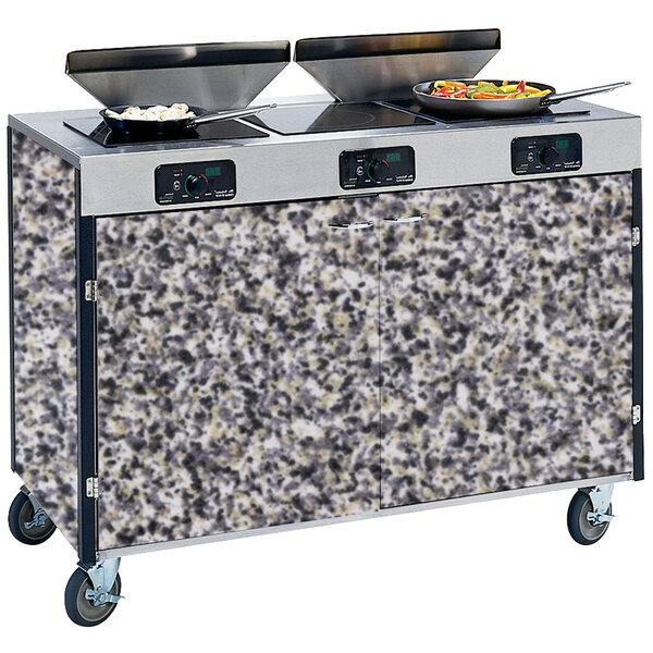 A Lakeside mobile kitchen cart with induction burners and pans on top.