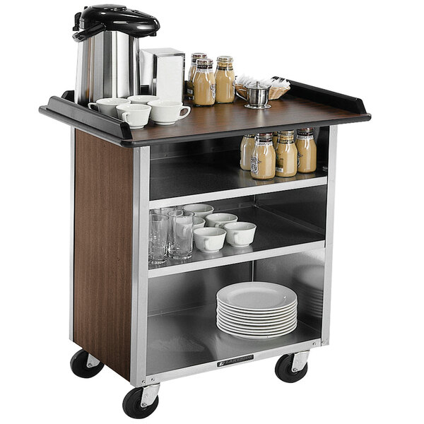 A Lakeside stainless steel beverage service cart with dishes and cups on the shelves.