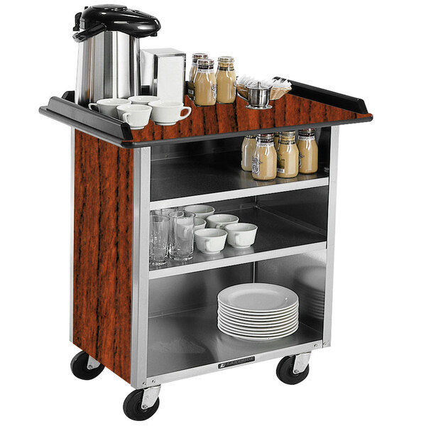 A Lakeside serving cart with a coffee maker and dishes on it.
