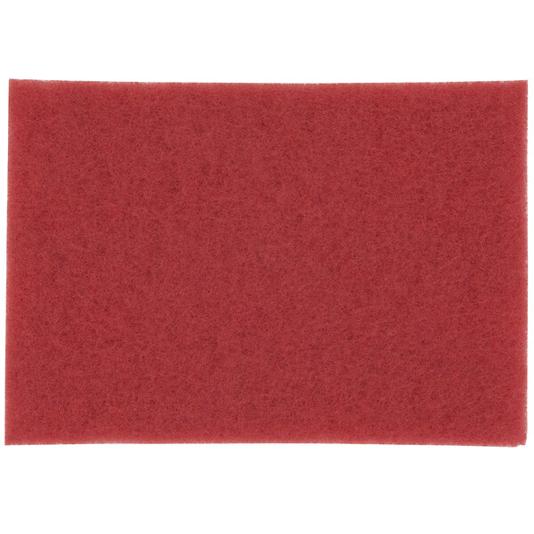 A red rectangular 3M buffing pad.