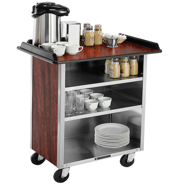 A Lakeside stainless steel beverage service cart with a coffee maker and plates on it.