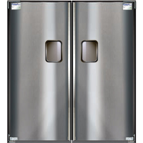 A close-up of the double stainless steel swinging traffic doors with two handles on each.