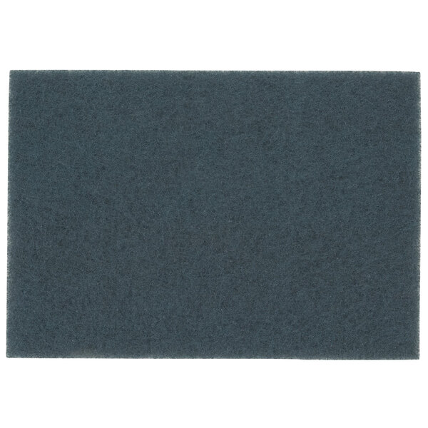 A blue rectangular 3M cleaner pad.