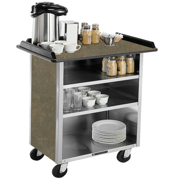 A Lakeside stainless steel beverage service cart with a variety of dishes and cups on it.