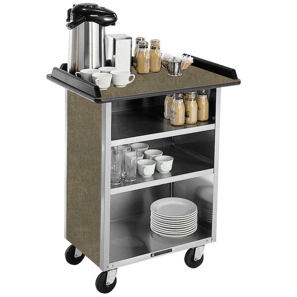 A Lakeside stainless steel beverage cart with shelves full of dishes and cups.