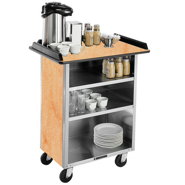A Lakeside stainless steel beverage service cart with coffee cups, dishes, and a coffee maker on it.
