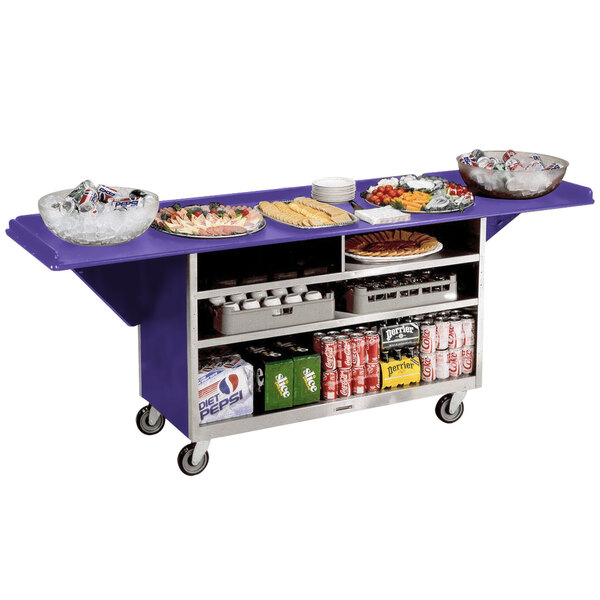 A Lakeside stainless steel drop-leaf beverage service cart with purple laminate finish full of food and drinks.
