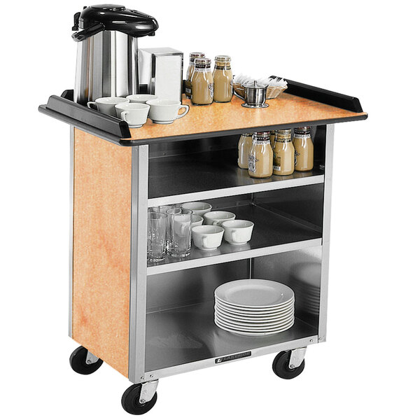 A Lakeside stainless steel beverage service cart with dishes and cups on it.