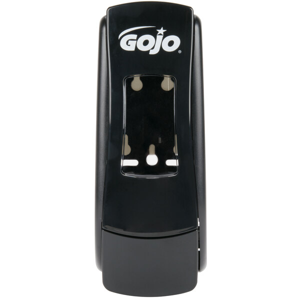 A close-up of a black GOJO® manual hand soap dispenser.
