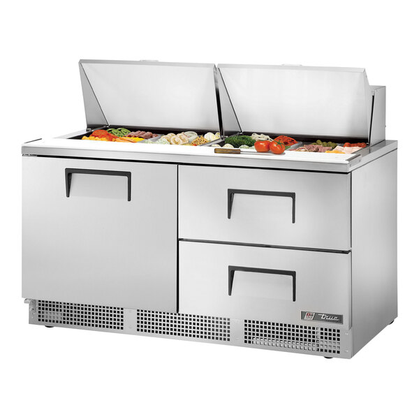 A True stainless steel Mega Top Refrigerated Sandwich Prep Table with door and two drawers.