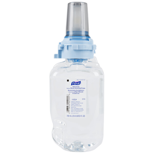A Purell bottle of foaming hand sanitizer with a blue cap.