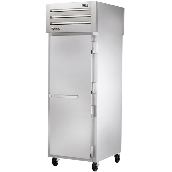 A True Spec Series pass-through freezer with a white door and silver hinges.