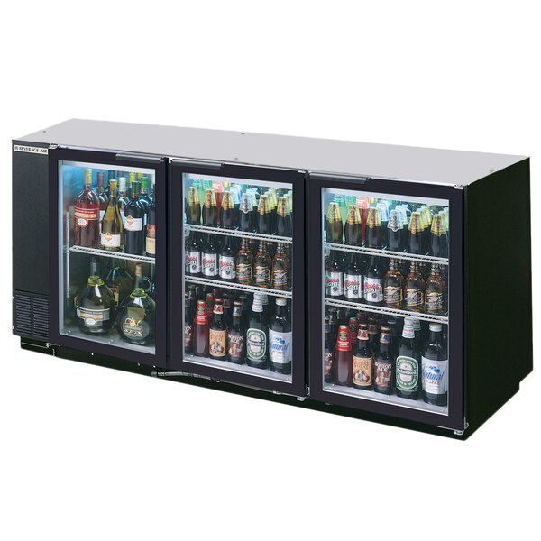 A black Beverage-Air back bar refrigerator with glass doors filled with beer and beverages.
