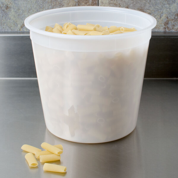 A translucent plastic 5.25 quart deli container filled with pasta.