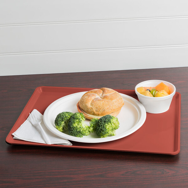 A raspberry cream dietary tray with food on it, including broccoli.
