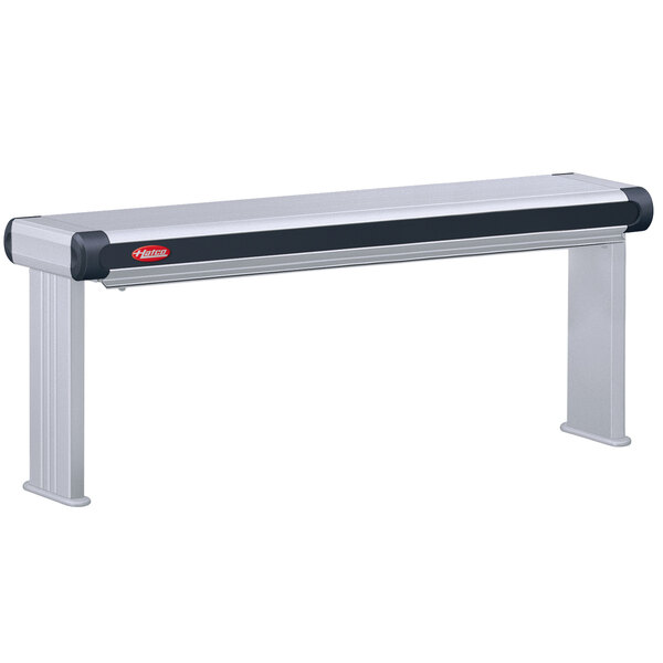 A long rectangular metal strip with a black and silver border on a table.