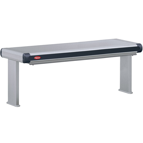 A grey and black rectangular Hatco Glo-Ray infrared strip warmer on a table in a bar.