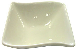 A CAC Soho ivory square stoneware bowl with a curved edge.