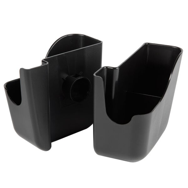 A white background with two black plastic San Jamar caddy holders with round holes.