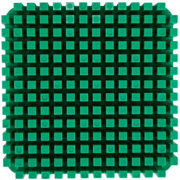 A close up of a green square with many small squares on it.