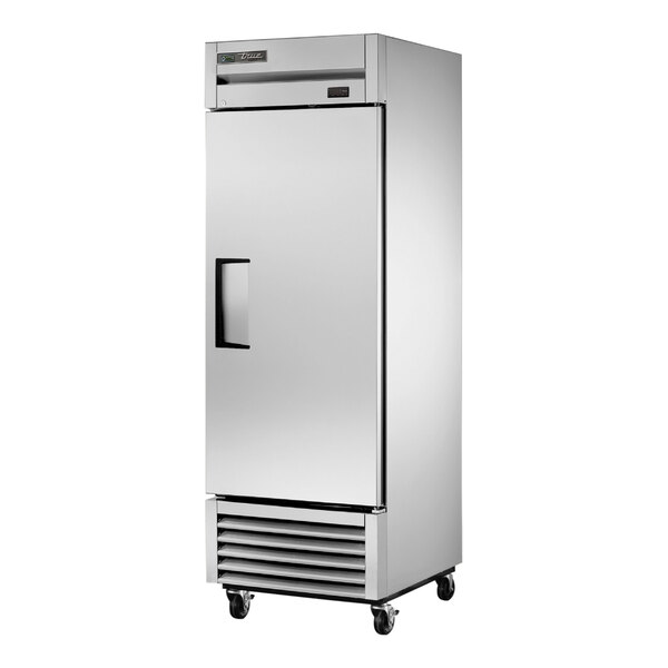A stainless steel True reach-in freezer with a black handle.