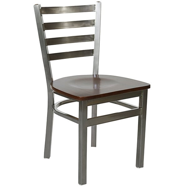 A BFM Seating metal side chair with a walnut wooden seat.