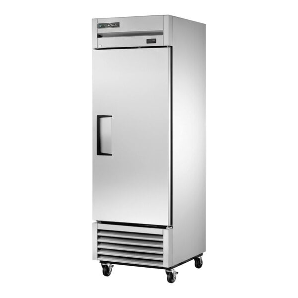 A white True reach-in freezer with a black handle.