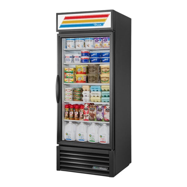 A black True refrigerated glass door merchandiser with dairy products inside.