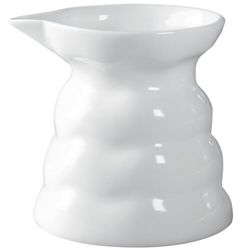 A 10 Strawberry Street bright white porcelain creamer with a small spout and handle.