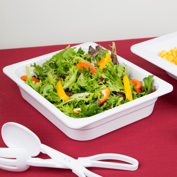 A vegetable salad in a white Thunder Group food container.