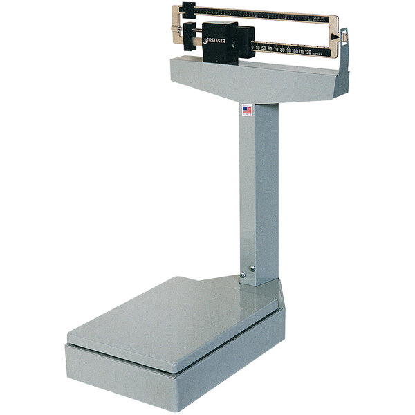 A Cardinal Detecto platform bench scale with a black handle.