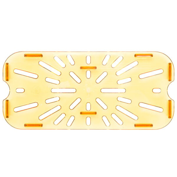 A yellow plastic Carlisle 1/3 size drain tray with holes.