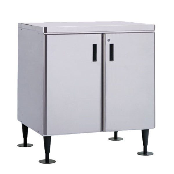A stainless steel Hoshizaki ice machine stand with white cabinet doors and drawers.