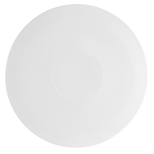 A close-up of a white plate with a circular pattern around the edge.