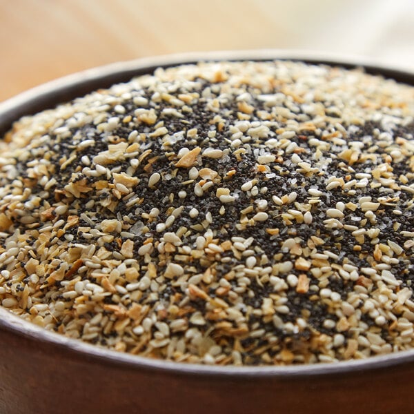 A bowl of black and white sesame seeds.