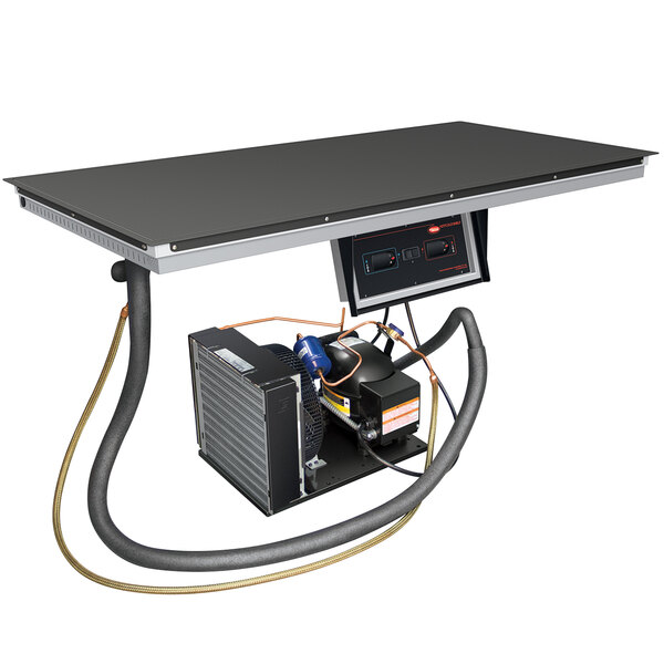 A black rectangular Hatco hot / cold shelf built into a table.