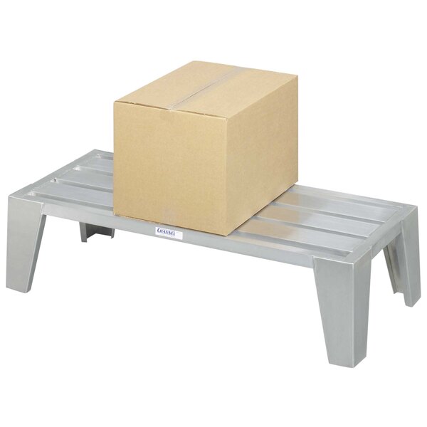 A Channel heavy-duty aluminum dunnage rack holding a box on a metal platform.