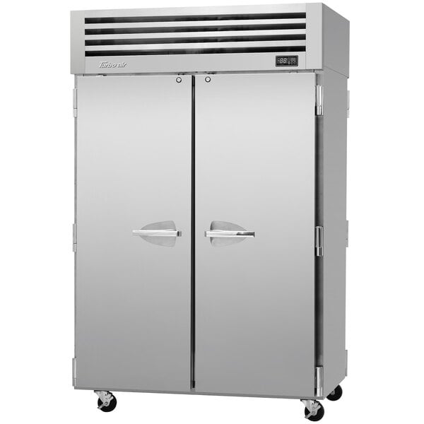 A large silver Turbo Air Premiere Pro pass-through refrigerator with two doors.
