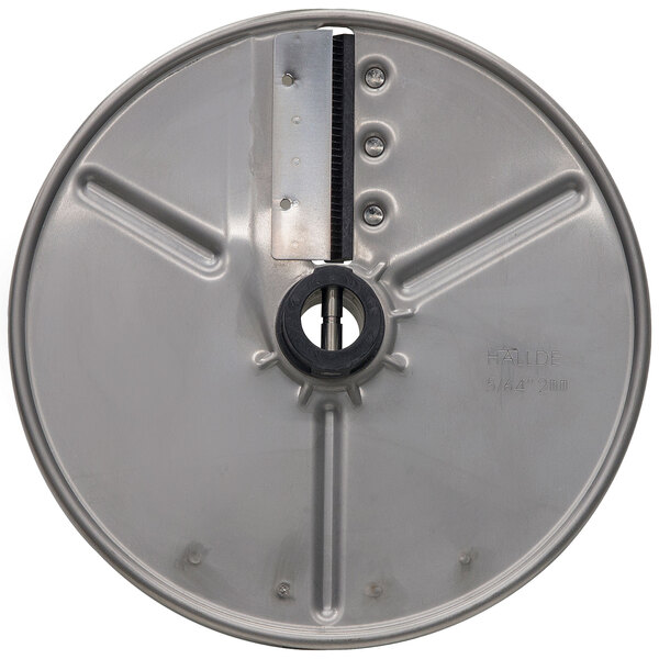 A circular stainless steel metal disc with a hole in the center.